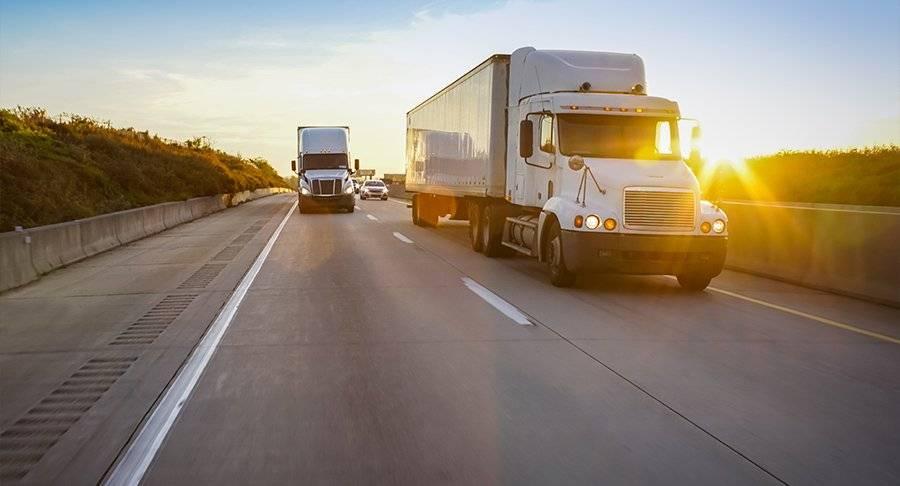 Trucks driving on the road ready for CVSA Roadcheck 2023.