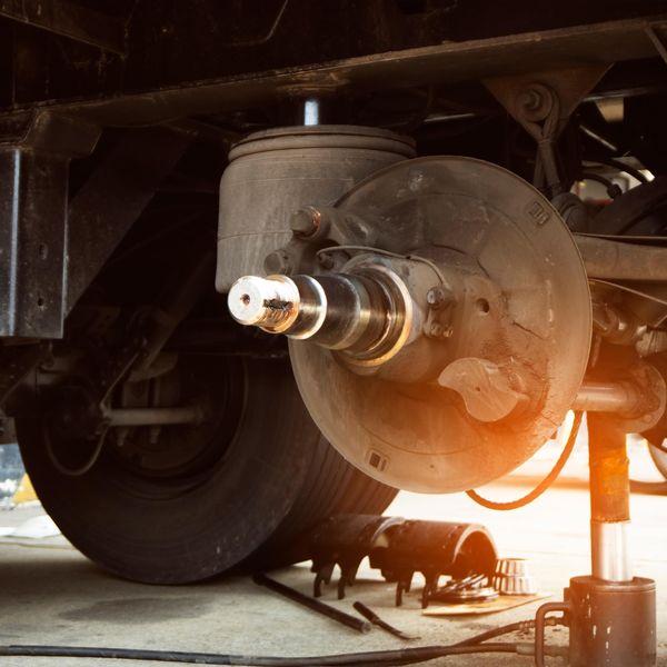 Wheel well and brake pads on a truck ready for maintenance